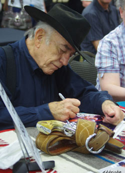 James Drury, “The Virginian”, signs an autograph.