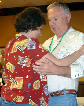 Tenderly recovering from an auto accident broken leg, Maxine Hansen of Autry Entertainment still managed one turn around the dance floor with Boyd Magers.