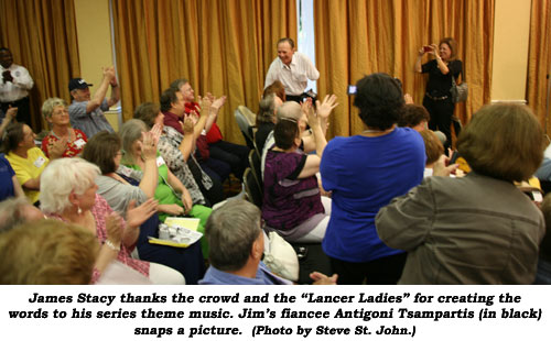 James Stacy thanks the crowd and the "Lancer Ladies" for creating the words to his series theme music. Jim's fiancee Antigoni Tsampartis (in black) snaps a picture. (Photo by Steve St. John.)