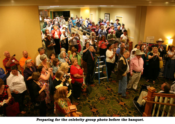 Preparing for the celebrity group photo before the banquet.