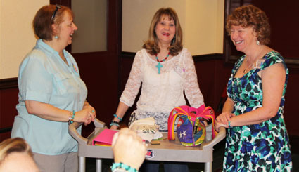 “A Gathering of Guns 5” wouldn’t have run as smooth as it did without the expert coordination of Bonnie Boyd (center). Seen here with Mary Olsen and Fliss Bonello.