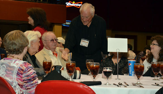 Robert Colbert stops by at the Saturday night banquet to say hello to Clu Gulager and Luster Bayless.