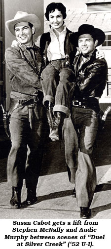 Susan Cabot gets a lift from Stephen McNally and Audie Murphy between scenes of "Duel at Silver Creek" ('52 U-I).