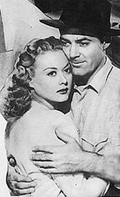 Allan Lane embraces Adele Mara in "Night Train to Memphis".