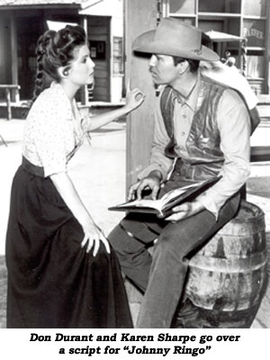 Don Durant and Karen Sharpe go over a script for "Johnny Ringo"