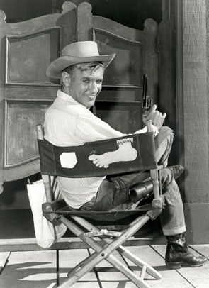 Will Hutchins as Sugarfoot sitting in his "Sweet Toes" chair.