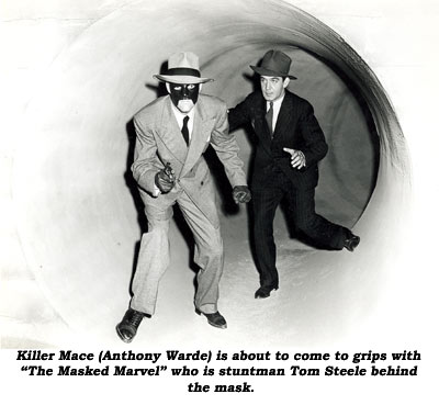 Killer Mace (Anthony Warde) is about to come to grips with "The Masked Marvel" who is stuntman Tom Steele behind the mask.