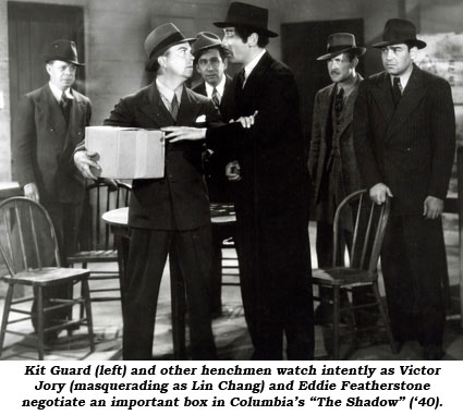 Kit Guard (left) and other henchmen watch intently as Victor Jory (masquerating as Lin Chang) and Eddie Featherstone negotiate an important box in Columbia's "The Shadow" ('40).