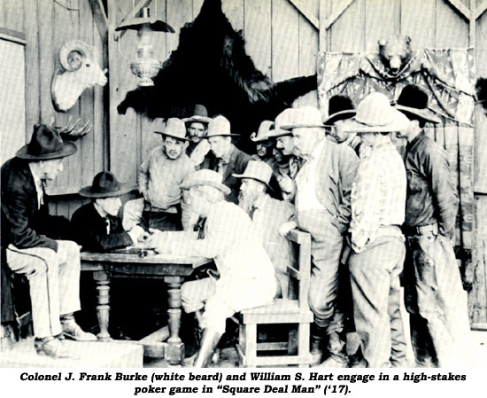 Colonel J. Frank Burke (white beard) and William S. Hart engage in a high-stakes poker game in "Square Deal Man" ('17).