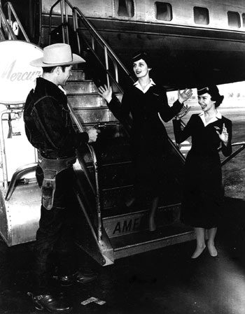 Kelo Henderson, star of TV’s “26 Men” (‘57-‘59), wouldn’t get anywhere near an airplane today with that gun as he did for this publicity shot at the Phoenix airport during the filming of “26 Men”.