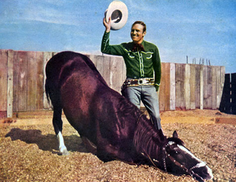 Gene with Champion as he performs a bow for the audience.