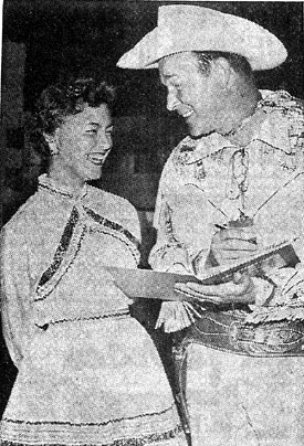 Above three photos taken during Roy Rogers’ appearance in early October 1957 for the New Mexico State Fair in Albuquerque. Top photo, Roy signs an autograph for 14 year old Janet Latsha. In the second photo Roy displays one of his guns for two members of a family of ten orphaned earlier in the year, Eddie and Gregory Chavez. In the third photo Roy shakes hands with children at the State Fair Coliseum.