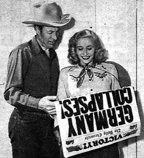 No one could be happier than Czech-born Vera Hruba Ralston as she reads the wonderful V-E Day headlines with Wild Bill Elliott on the Republic back lot in 1945. (Thanx to Bobby Copeland.)