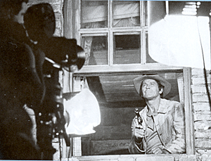 For Sergio Leone’s “Once Upon a Time in the West”, while seemingly the exterior of a hotel room window in broad daylight, this close up of Charles Bronson shooting the man atop the clock tower across the street was actually filmed in the studio. 