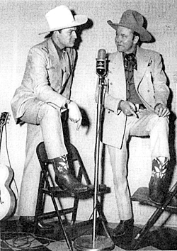 Tex Ritter tells singer Wesley Tuttle, “Your boots are the same as mine!” 