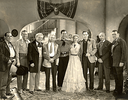 “Deep in the Heart of Texas” (‘42 Universal). (L-R) Eddie Polo, Tex Ritter, William Farnum, director Elmer Clifton, Johnny Mack Brown, Jennifer Holt, writer/producer Oliver Drake, Pat O’Malley, Kenneth Harlan.