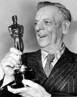 Broncho Billy Anderson holds his honorary Oscar presented to him by the Motion Picture Academy at the 1958 Academy Awards. (Courtesy Bobby Copeland.)