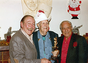 B-Western badmen Myron Healey and Terry Frost alongside Masquers Club awardee director Oliver Drake.