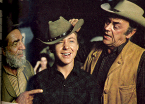 Frank McGrath and John McIntire kid Michael Burns on the set of “Wagon Train”.