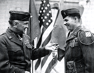 The most decorated soldier during WWII, Audie Murphy was awarded more than 28 combat decorations including the nation's highest military award, The Medal of Honor. Here he is being congratulated for his Medal of Honor by General John O'Daniel. Audie insisted he receive the award in the field rather than coming to Washington for a presidential ceremony. 