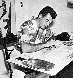 "The Texan", Rory Calhoun, works out a few things at his home desk. 