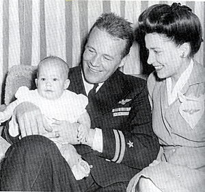 Wayne Morris flew F6F-3 Hellcats off the aircraft carrier U.S.S. Essex with Navy Fighter Squadron 15. Pictured here with his wife Patricia Ann O'Rourke and their daughter Pam. 