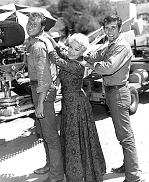 Spring Byington checks out the height of her two leading men on "Laramie", John Smith and Robert Fuller.