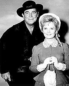 Rod Cameron and Olive Sturgess while making "Requiem For a Gunfighter" ('65).