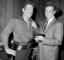 Richard Boone gets an honorary sheriff's badge from county sheriff 
Peter Pitchess in 1961.