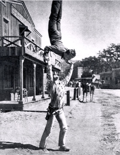 “Range Rider” Jock Mahoney supports his pard, Dick West (Dick Jones), on the streets of Corriganville. Note the observing horse who can't quite believe his eyes. (Photo courtesy Terry Cutts.)