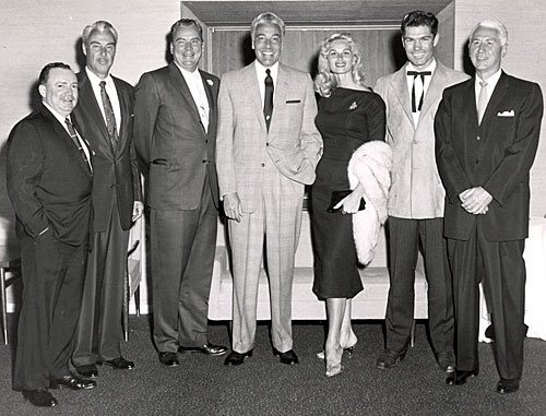 1958 photo taken during the filming of the TV series “26 Men”. (L-R) Irish McCalla’s agent Shorty, Tris Coffin, series producer Russell Hayden, Cesar Romero, Irish (“Sheena”) McCalla, Kelo Henderson and ABC president George Shubert.