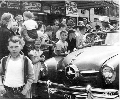 New Republic star Rex Allen signs autographs in Bloomington, IL, in 1949 with his first film “Arizona Cowboy” playing at the local theatre. (Thanx to Bobby Copeland.)