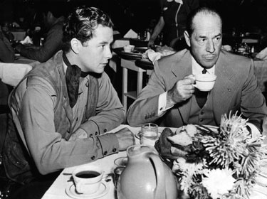 Sharing a cup of coffee at RKO are father and son Tim and Jack Holt. Circa early ‘40s.