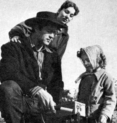 Clint explains to Verna and Valerie Jean how the pointer can indicate the presence of ore.