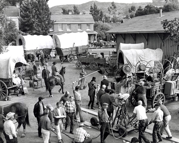 Filming a scene for “The Travels of Jaimie McPheeters” with Dan O’Herlihy and Kurt Russell (center). (Thanx to Neil Summers.)