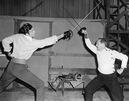 Rod Cameron gets a fencing lesson in preparation for “Pirates of Monterey” (‘47 Universal). (Thanx to Bobby Copeland.)