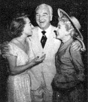 Joan Crawford chats with Bill (“Hopalong Cassidy”) Boyd and wife Grace Bradley circa 1951.