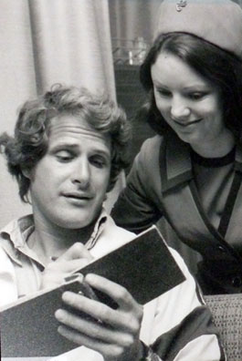 Ben Murphy of “Alias Smith and Jones” signs an autograph book for an Air New Zealand stewardess. (Thanx to Terry Cutts.)