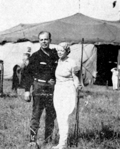 Hoot Gibson and Mrs. Poodles Hanneford on the Hagenbeck-Wallace Circus lot in Norfolk, VA on August 9, 1937.