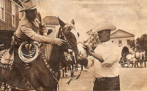 Final touches to Champion’s makeup job are supervised by Gene Autry just before moving into camera range for “Silver Canyon” (‘51 Columbia).