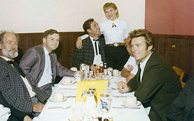 While appearing at a rodeo in Sikeston, MO, Paul Brinegar, Sheb Wooley and Clint Eastwood enjoy a bite to eat at the War Drum restaurant in the Gay 90s Village in Sikeston. 