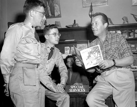 Wayne Morris on a tour of military bases in France, Germany, Austria and Italy in May, 1954, talks with some soldiers at the Carlton Hotel in Frankfurt, Germany. As a Navy pilot flying off the U. S. S. Essex, Morris shot down 7 Japanese planes and helped sink several enemy ships. (Thanx to Bobby Copeland.)