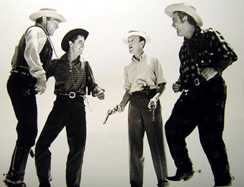 Randolph Scott, Glenn Ford and Big Boy Williams enjoy a light moment with set visitor Fred Astaire during the making of “The Desperadoes” (‘43 Columbia). (Photo courtesy Bobby Copeland.)